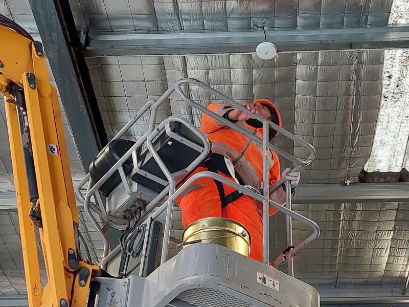 Smoke sensor installed on the roof of factory.